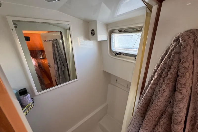 Slide: The Image of Bathroom interior of 2006 Albin 40 North Sea Cutter with mirror and window. - 67