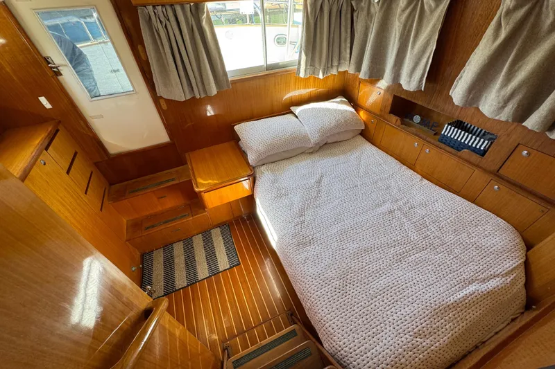 Slide: The Image of Cozy cabin interior of 2006 Albin 40 North Sea Cutter with wooden finish and bed. - 68