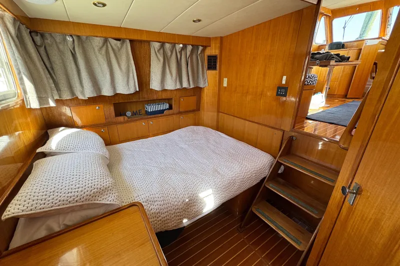 Slide: The Image of Cozy cabin interior of 2006 Albin 40 North Sea Cutter with wooden finish and bed. - 69
