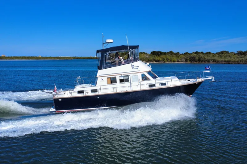 Slide: The Image of 2006 Albin 40 North Sea Cutter cruising on a sunny day, creating waves. - 7