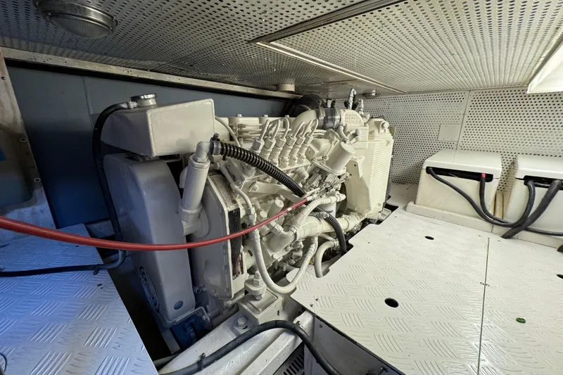 Slide: The Image of Engine room of 2006 Albin 40 North Sea Cutter, showcasing detailed machinery and components. - 74