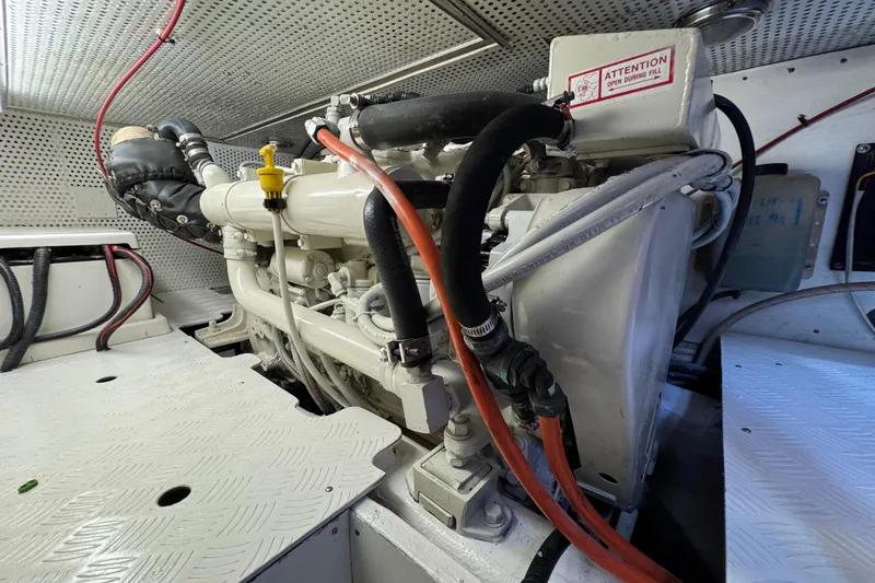 Slide: The Image of Engine room of 2006 Albin 40 North Sea Cutter with visible machinery and cables. - 75