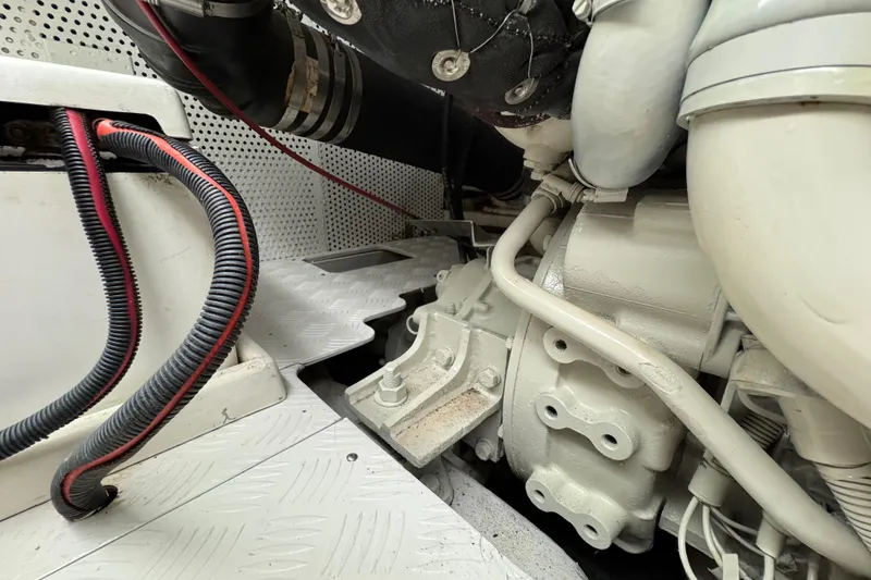 Slide: The Image of Engine compartment of a 2006 Albin 40 North Sea Cutter, showing mechanical components and wiring. - 76
