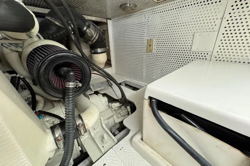 Slide: The Image of Engine room of 2006 Albin 40 North Sea Cutter with visible components and wiring. - 77