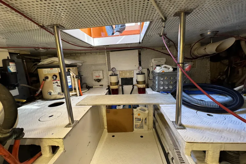 Slide: The Image of Engine room of a 2006 Albin 40 North Sea Cutter, featuring equipment and storage. - 79