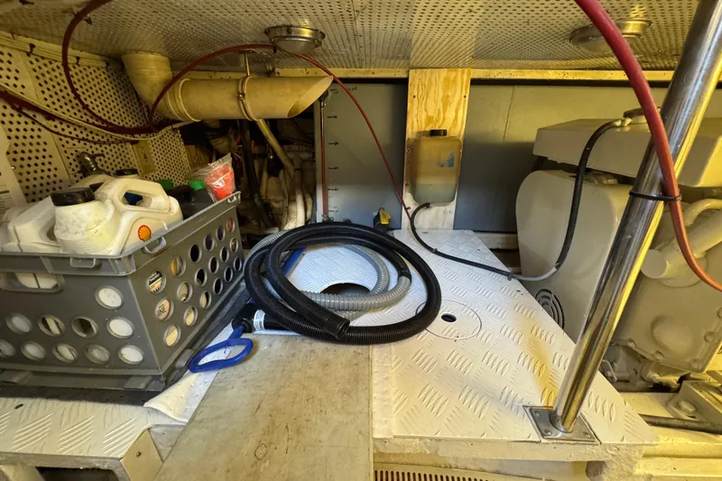Slide: The Image of Engine room of a 2006 Albin 40 North Sea Cutter with storage and equipment. - 81