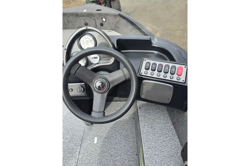 Slide: The Image of Steering console of 2026 Alumacraft Classic 165 CS boat with gauges and controls. - 5