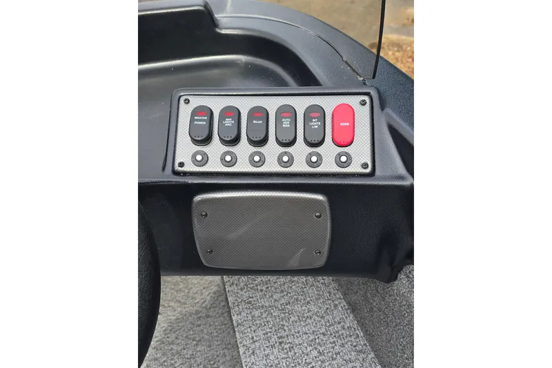 Slide: The Image of Control panel of 2026 Alumacraft Classic 165 CS boat with labeled switches. - 9