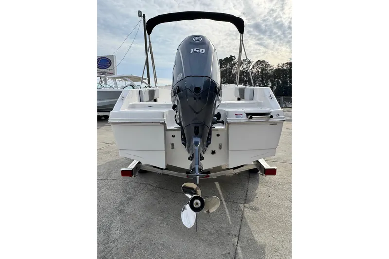 Slide: The Image of 2026 Robalo R180 Center Console boat with 150 HP outboard motor, rear view. - 3