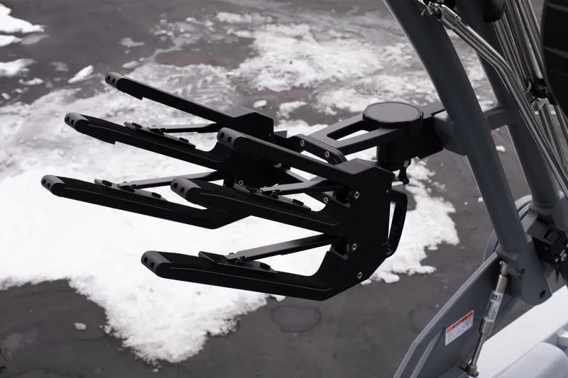 Slide: The Image of 2026 MasterCraft XT22 wakeboard rack on snowy ground. - 23