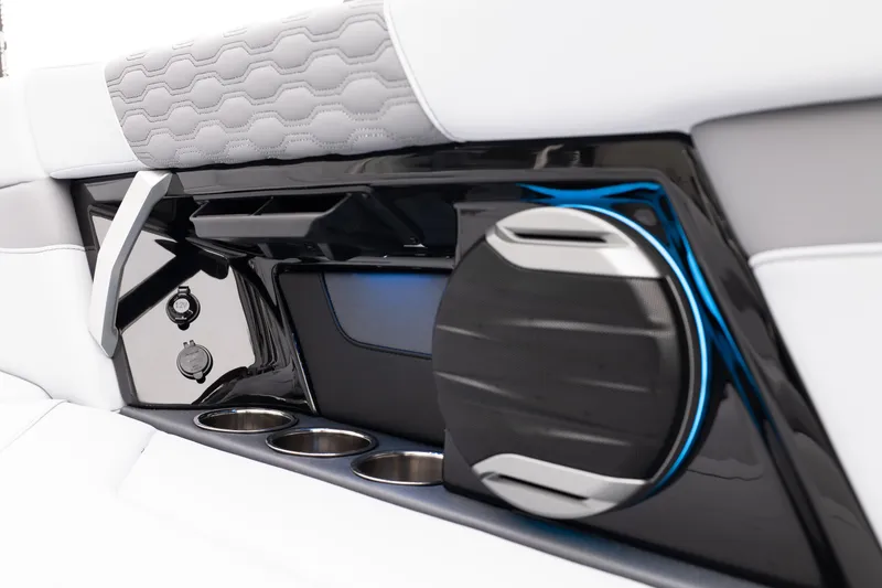 Slide: The Image of 2026 MasterCraft XT22 interior with sleek speaker, cup holders, and modern design elements. - 24