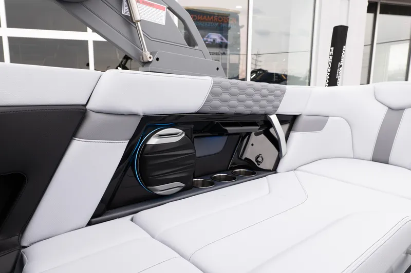 Slide: The Image of 2026 MasterCraft XT22 interior with sleek seating, cup holders, and modern speaker system. - 25
