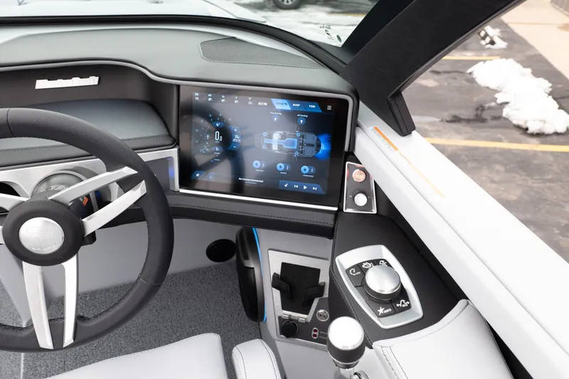 Slide: The Image of 2026 MasterCraft XT22 dashboard with touchscreen display and modern steering wheel design. - 27