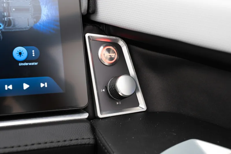 Slide: The Image of 2026 MasterCraft XT22 control panel with touchscreen and audio knob. - 28