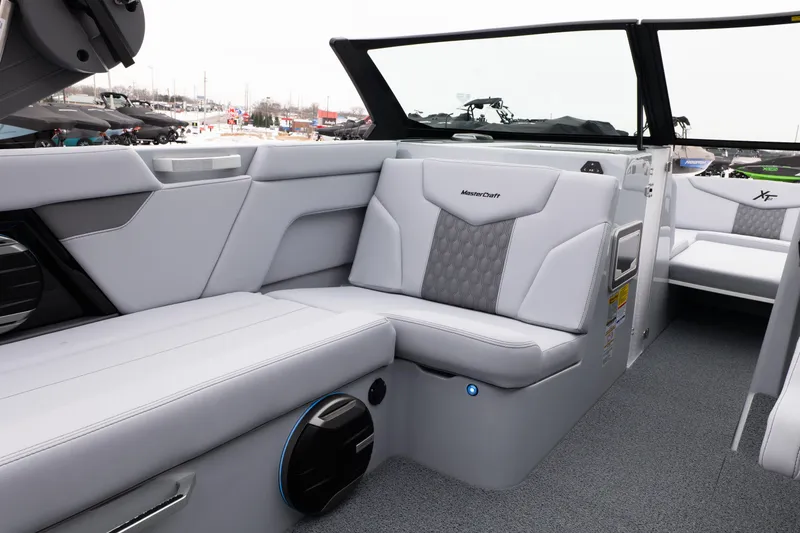 Slide: The Image of 2026 MasterCraft XT22 boat interior with luxurious seating and modern design. - 30