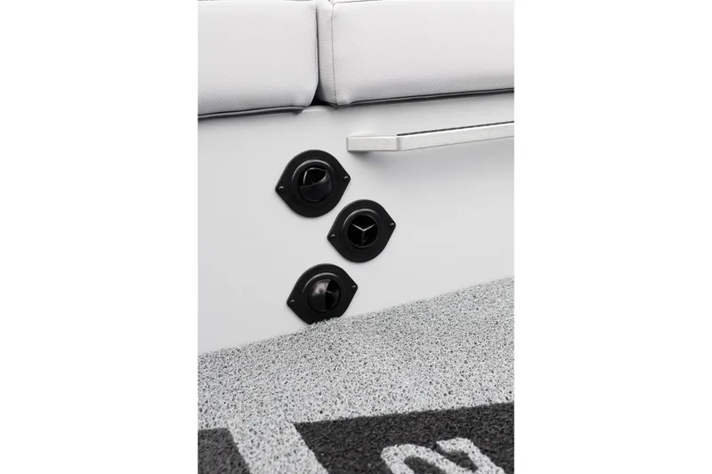 Slide: The Image of 2026 MasterCraft XT22 interior detail with control knobs and textured flooring. - 36