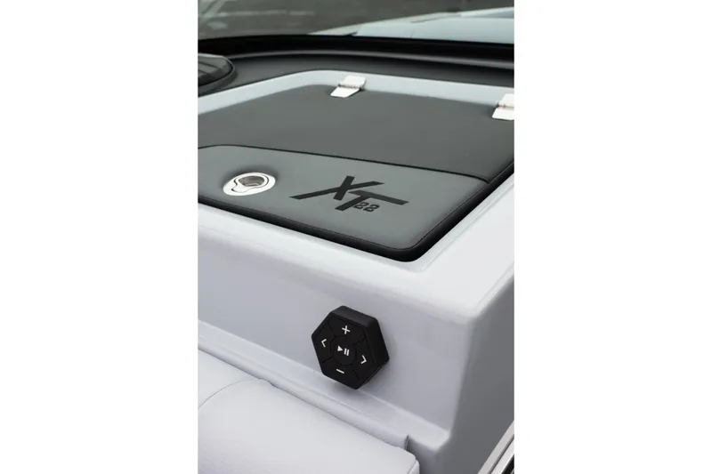 Slide: The Image of 2026 MasterCraft XT22 boat interior detail with control panel and logo. - 41