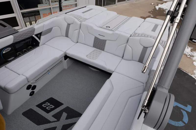 Slide: The Image of 2026 MasterCraft XT22 boat interior with sleek, modern seating and stylish design. - 44