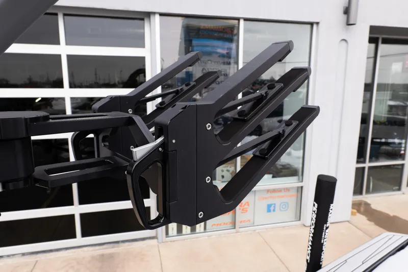 Slide: The Image of 2026 MasterCraft XT22 boat accessory, featuring a sleek black wakeboard rack design. - 45