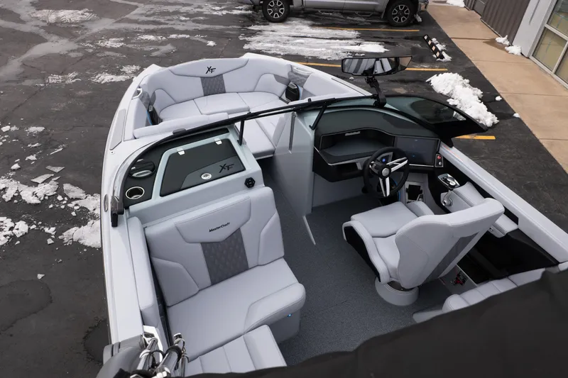 Slide: The Image of 2026 MasterCraft XT22 boat interior with modern seating and sleek dashboard design. - 47
