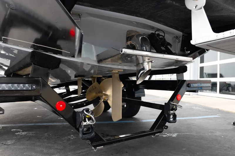 Slide: The Image of 2026 MasterCraft XT22 boat propeller and trailer detail in a showroom setting. - 7