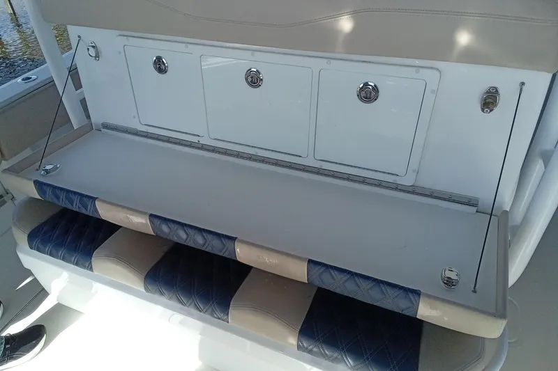 Slide: The Image of 2022 Invincible 39 Open Fisherman boat seating and storage area. - 13