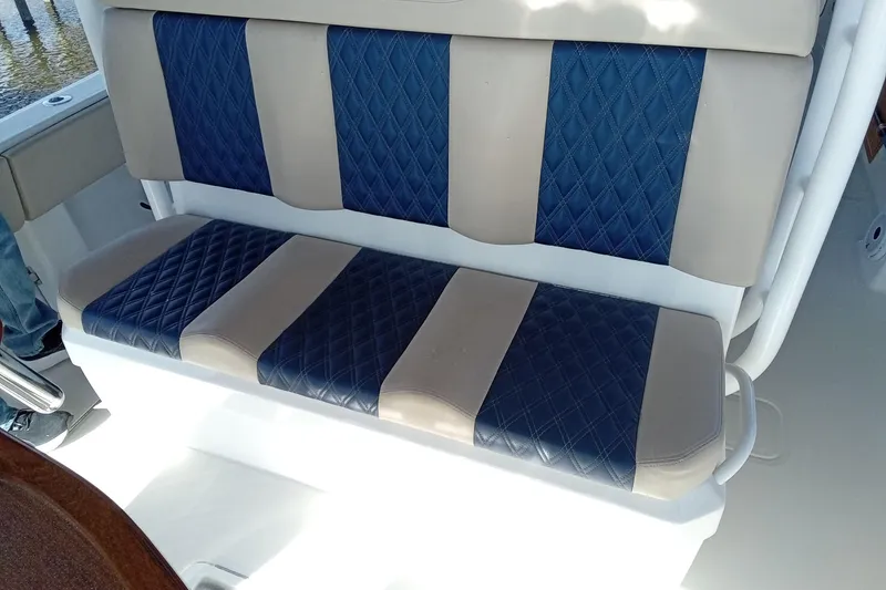 Slide: The Image of 2022 Invincible 39 Open Fisherman boat seat with blue and beige diamond-patterned upholstery. - 14