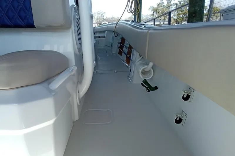 Slide: The Image of 2022 Invincible 39 Open Fisherman interior with seating and storage features. - 15