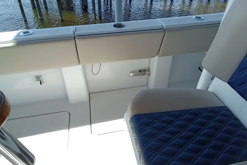 Slide: The Image of Interior view of 2022 Invincible 39 Open Fisherman boat with blue quilted seating. - 18