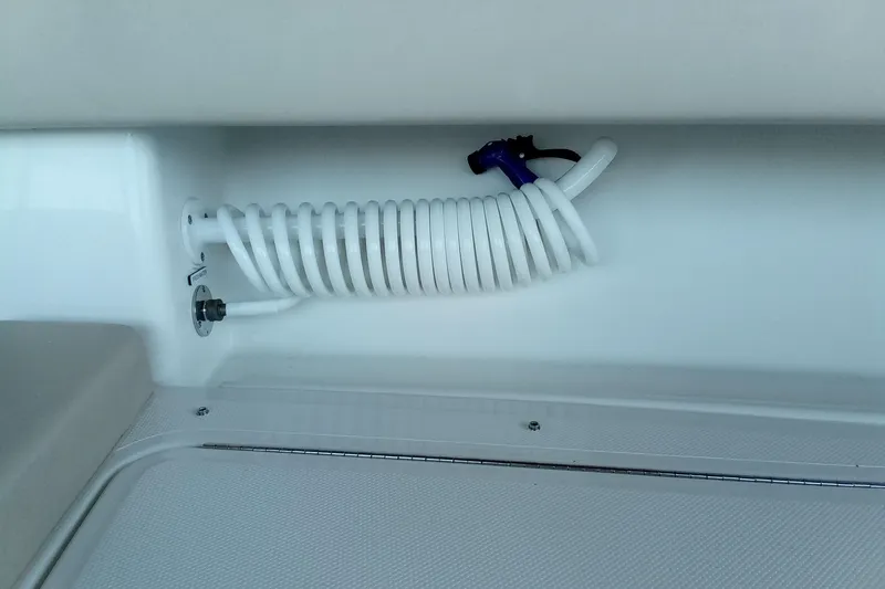 Slide: The Image of Coiled hose in 2022 Invincible 39 Open Fisherman boat interior. - 23