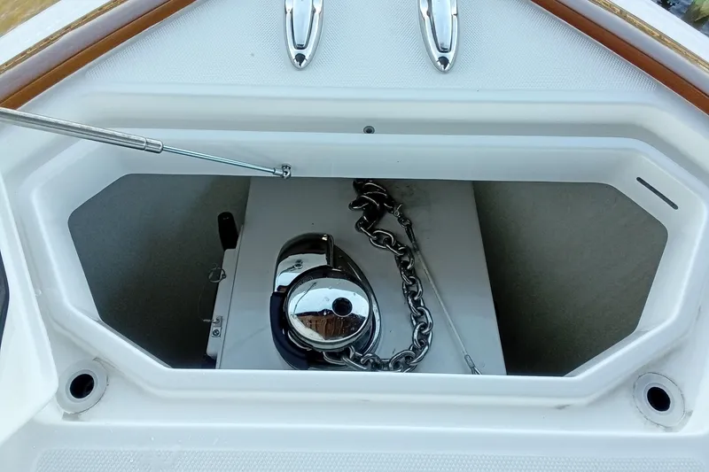 Slide: The Image of Anchor compartment of 2022 Invincible 39 Open Fisherman boat with chain and winch. - 24