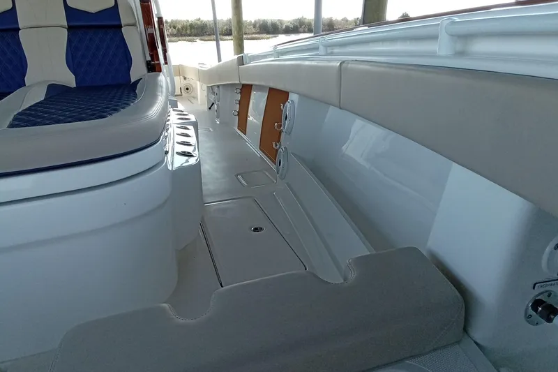 Slide: The Image of Interior view of 2022 Invincible 39 Open Fisherman boat, featuring seating and storage. - 28