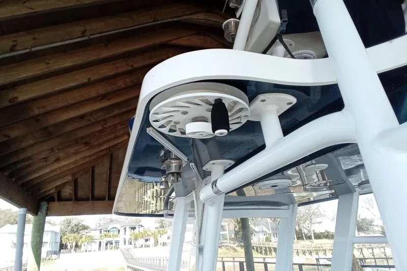 Slide: The Image of 2022 Invincible 39 Open Fisherman boat detail under wooden dock. - 29