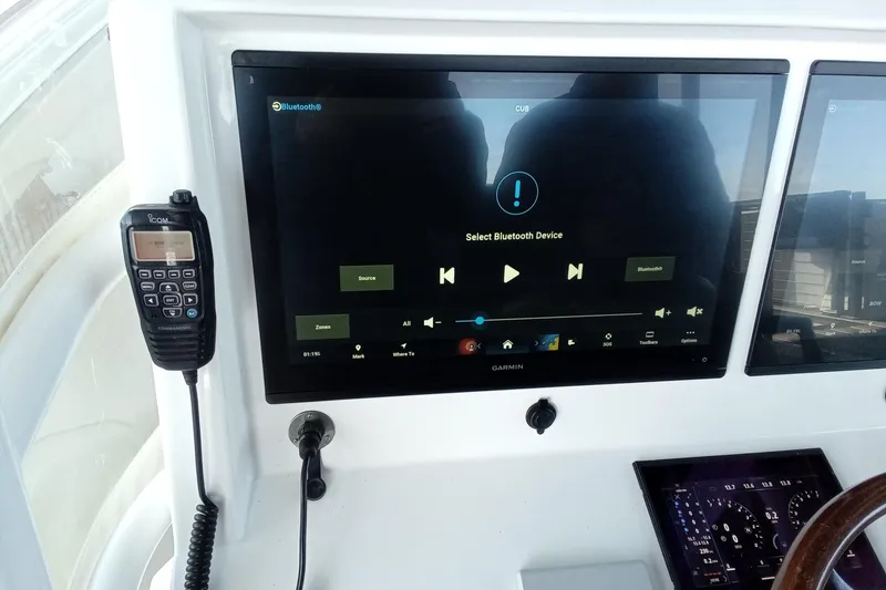 Slide: The Image of Control panel of 2022 Invincible 39 Open Fisherman with Garmin display and radio. - 33