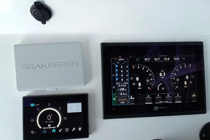 Slide: The Image of Control panel of 2022 Invincible 39 Open Fisherman with Seakeeper display and gauges. - 35
