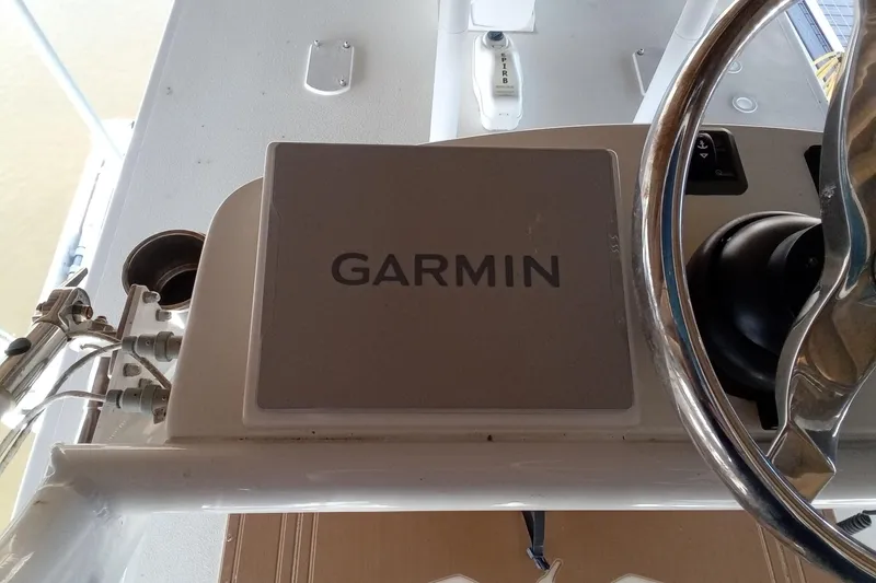 Slide: The Image of Garmin navigation system on 2022 Invincible 39 Open Fisherman boat dashboard. - 39