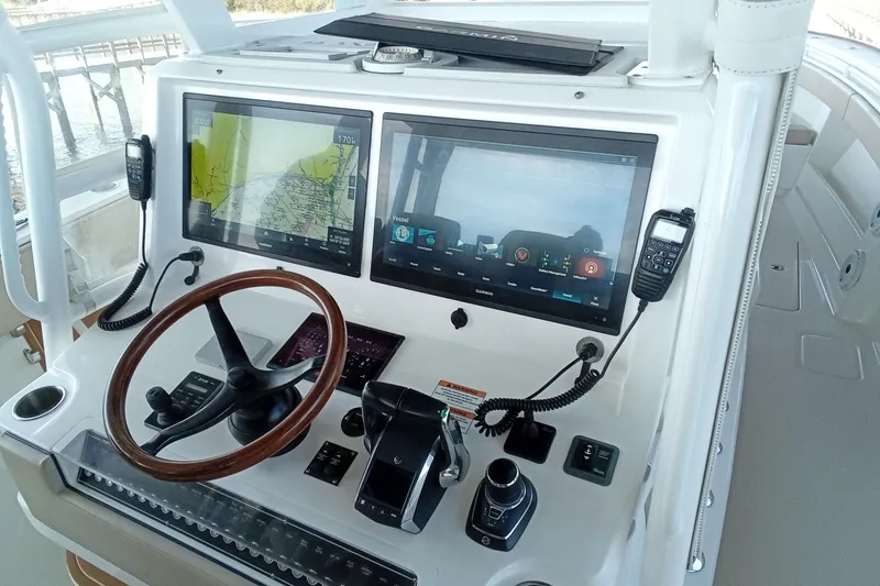 Slide: The Image of 2022 Invincible 39 Open Fisherman helm with dual displays and controls. - 47