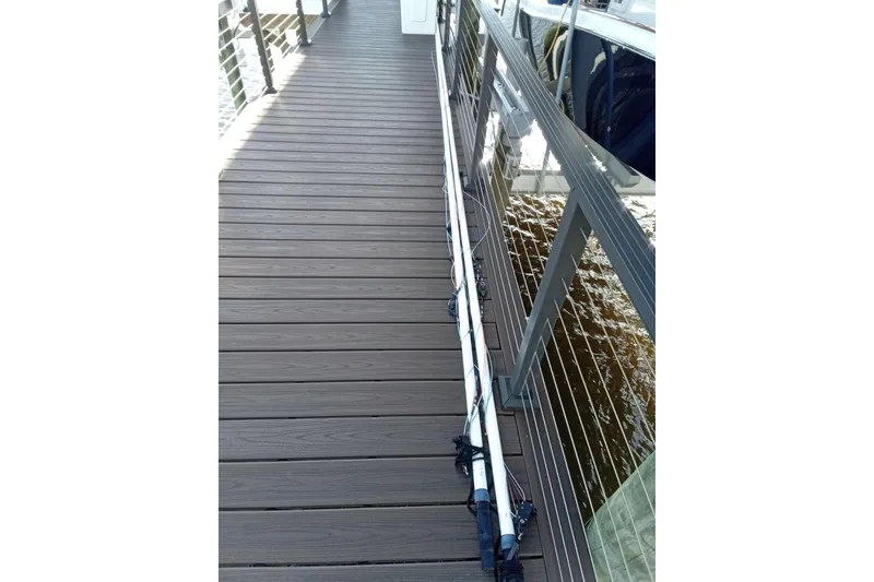 Slide: The Image of Dockside view of 2022 Invincible 39 Open Fisherman boat with fishing rods. - 48