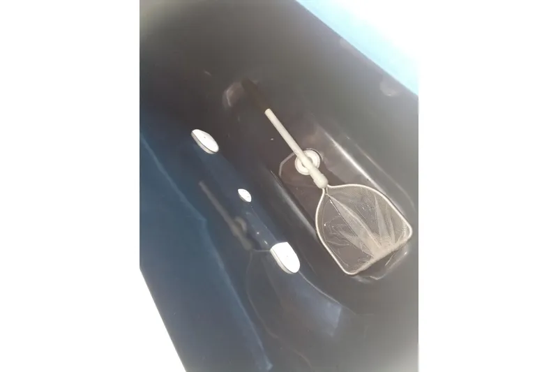 Slide: The Image of Livewell with net inside 2022 Invincible 39 Open Fisherman boat. - 5