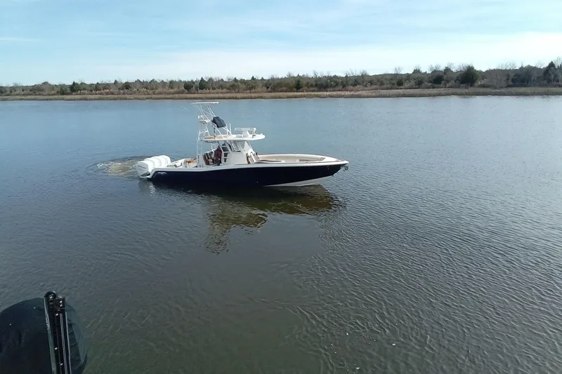 Slide: The Image of 2022 Invincible 39 Open Fisherman boat on calm water. - 58