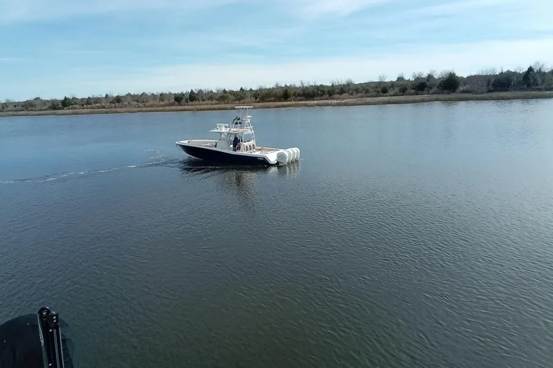 Slide: The Image of 2022 Invincible 39 Open Fisherman boat cruising on calm water. - 60