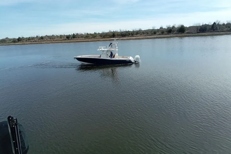 Slide: The Image of 2022 Invincible 39 Open Fisherman boat cruising on calm water. - 61