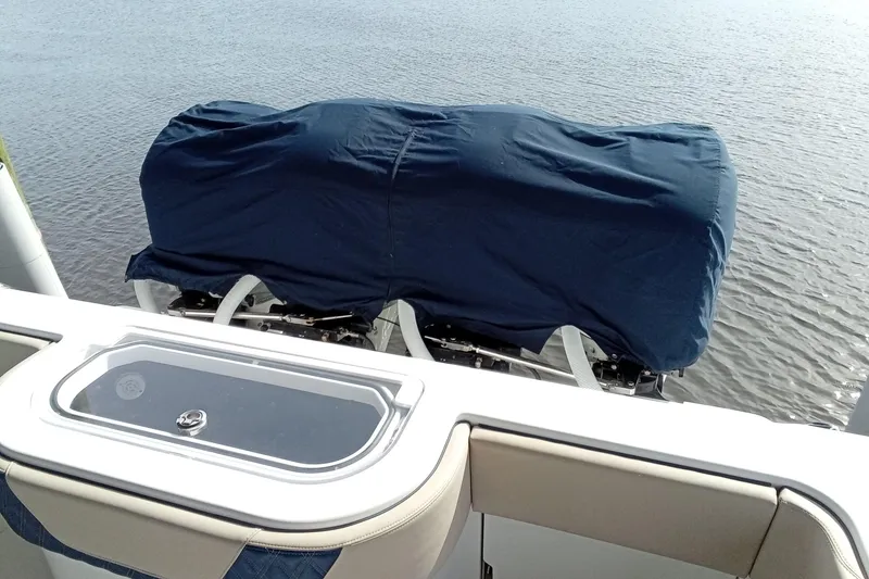 Slide: The Image of 2022 Invincible 39 Open Fisherman boat with covered engines on calm water. - 68