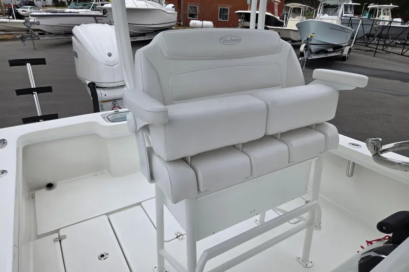Slide: The Image of 2026 Pair Customs 24 Center Console MV with white cushioned seating and armrests. - 12