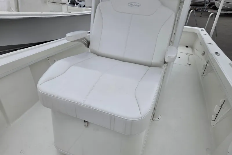 Slide: The Image of 2026 Pair Customs 24 Center Console MV boat with white seating and armrests. - 18