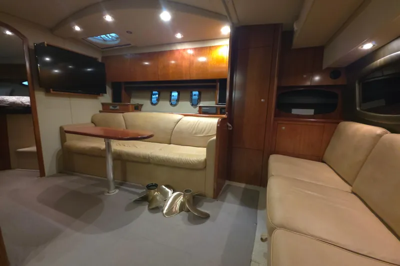 Slide: The Image of 2008 Cruisers Yachts 390 Sports Coupe interior with beige seating and wooden cabinetry. - 15