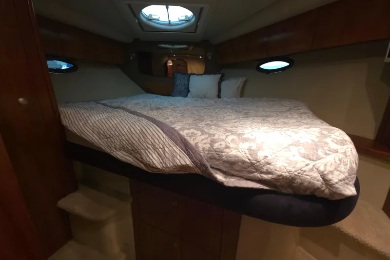 Slide: The Image of Luxurious cabin interior of 2008 Cruisers Yachts 390 Sports Coupe with cozy bedding. - 18
