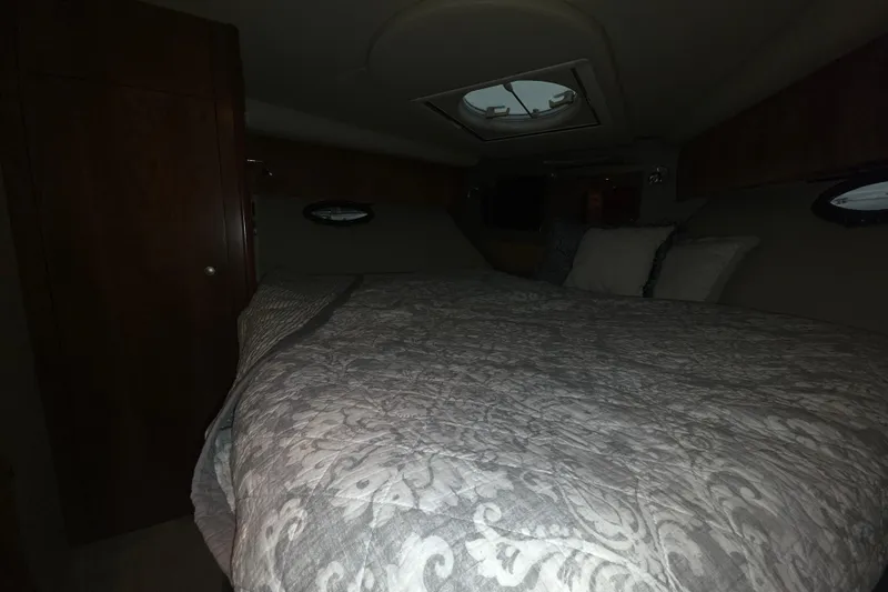 Slide: The Image of Interior cabin of 2008 Cruisers Yachts 390 Sports Coupe with bed and wooden cabinetry. - 22