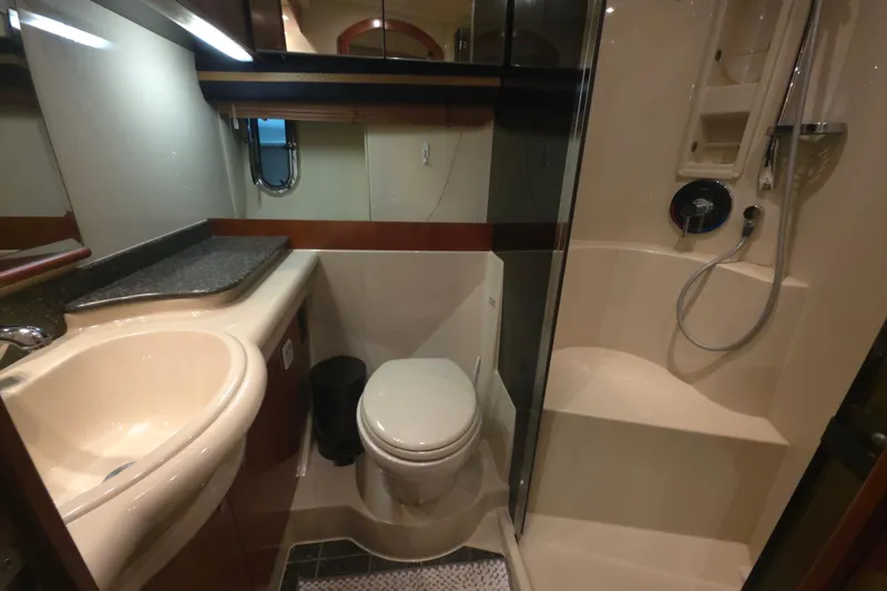 Slide: The Image of Luxurious bathroom in 2008 Cruisers Yachts 390 Sports Coupe with shower and sink. - 23