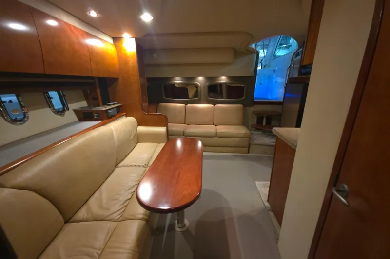 Slide: The Image of Luxurious interior of 2008 Cruisers Yachts 390 Sports Coupe with leather seating and wooden accents. - 28